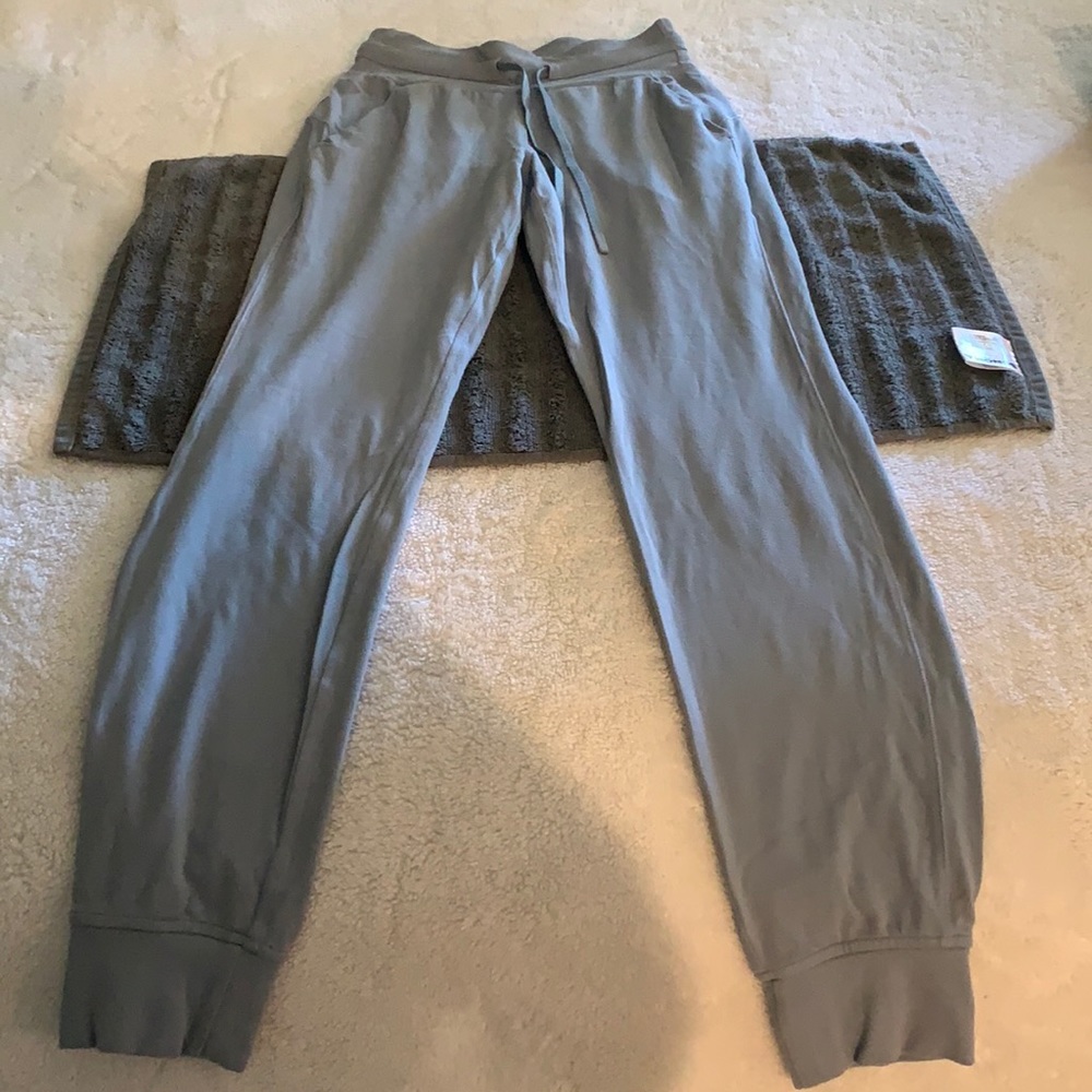 Align joggers in a light blue grey color. Pockets and waist tie. Adorable color